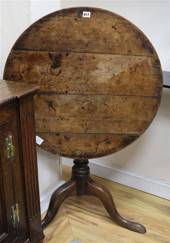 A George III oak tripod table W.73cm